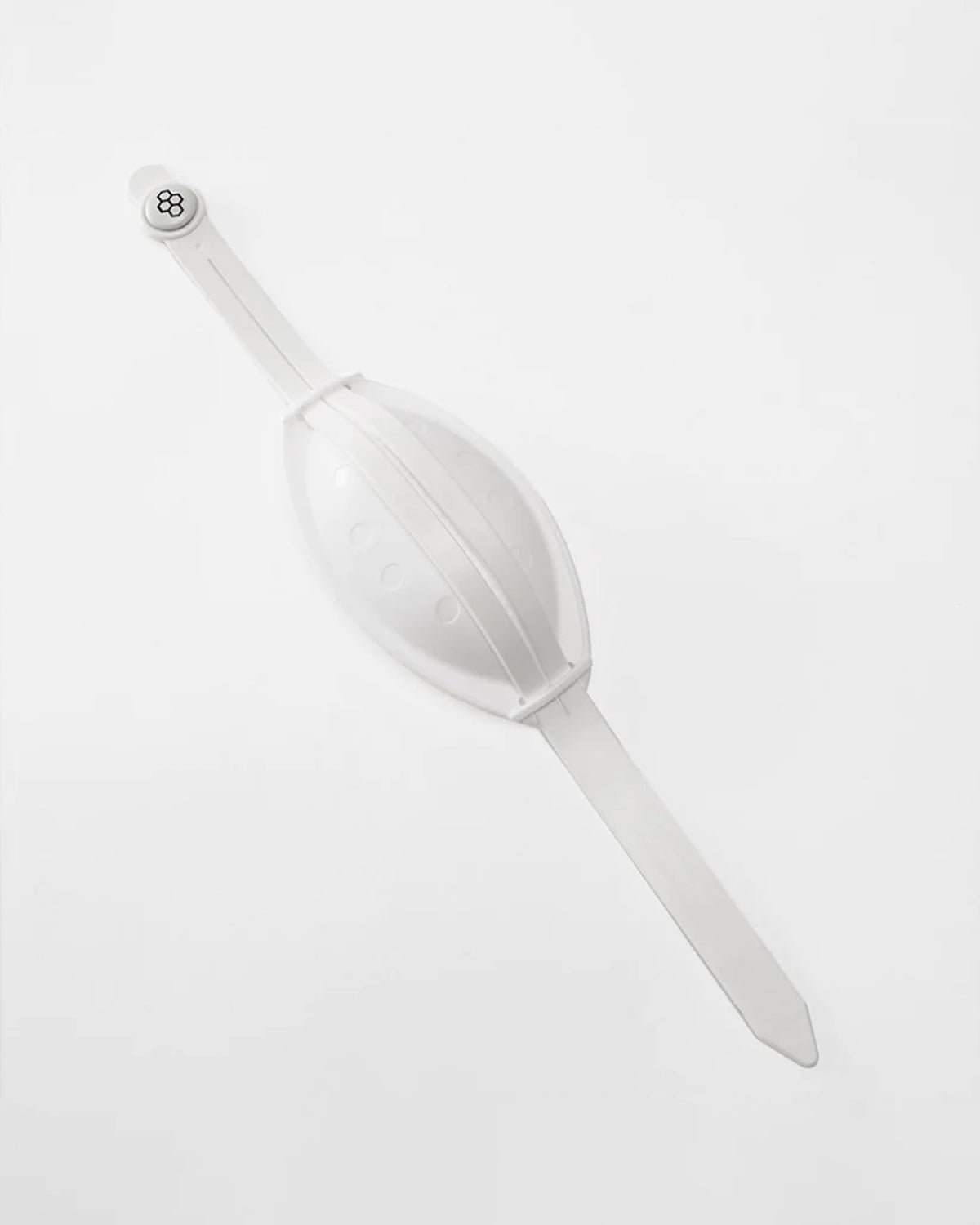 White plastic scoop on a light gray background