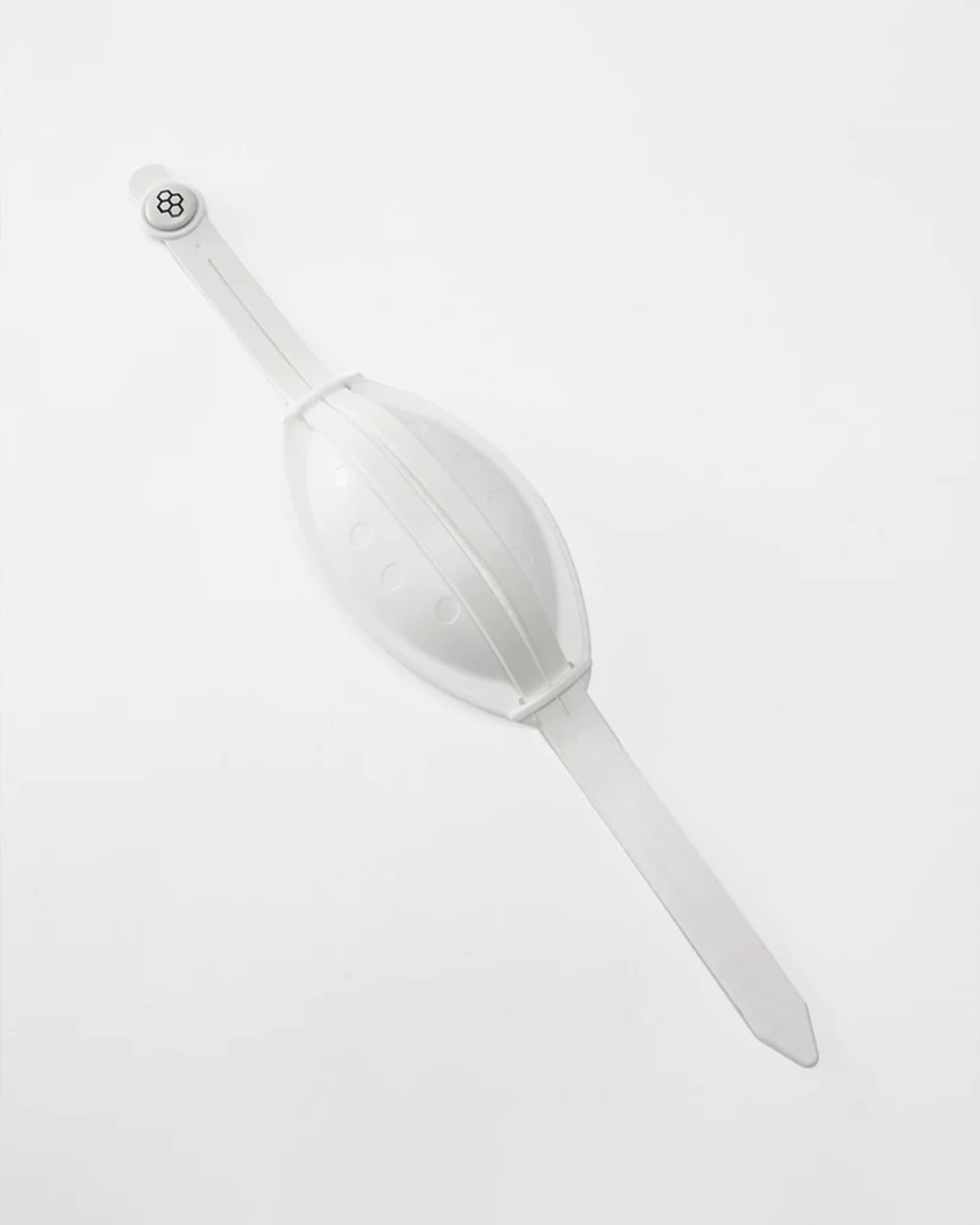 White plastic scoop on a light gray background
