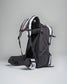 A sleek black and gray backpack with ergonomic straps and a side pocket designed for comfort and durability