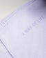 A close-up view of a soft lavender fabric featuring the phrase A WAY OF LIFE elegantly displayed in a subtle print