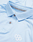 A light blue polo shirt with a woven texture featuring a simple white logo and branded label inside the collar