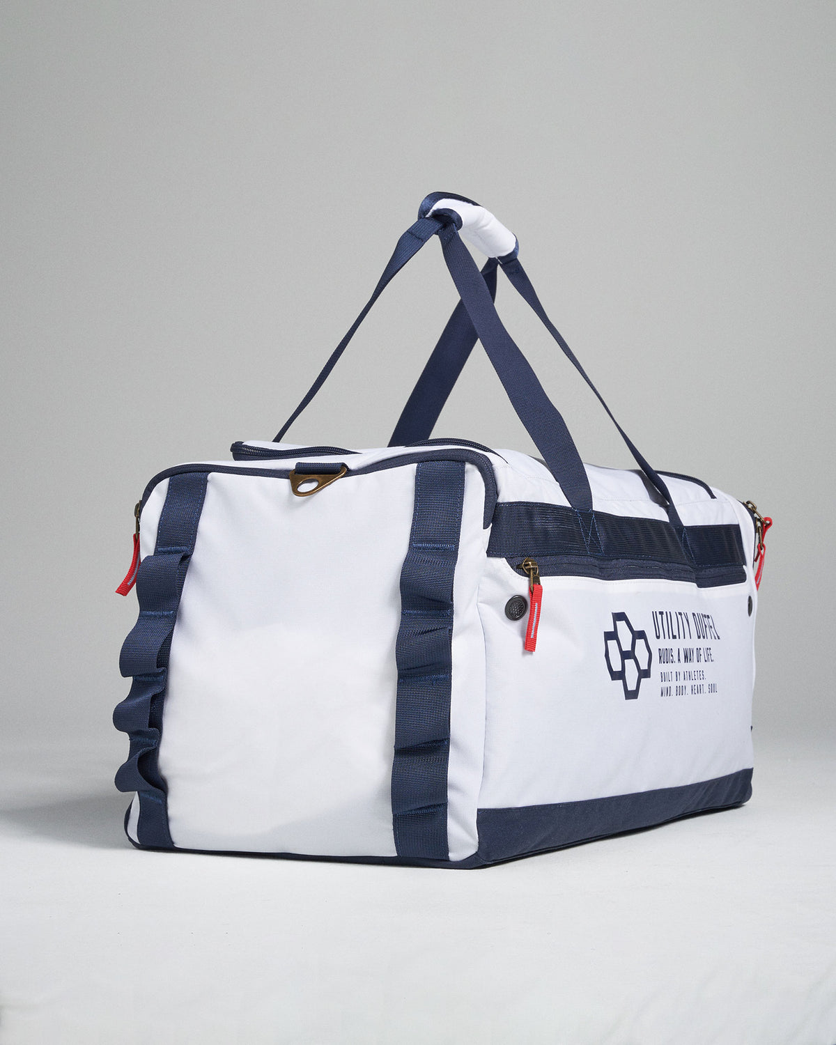 A practical white and navy duffel bag featuring multiple compartments and a sleek design ideal for travel or gym use