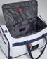 A white utility duffel bag with a spacious interior and red zip pulls showcasing compartments for organized storage