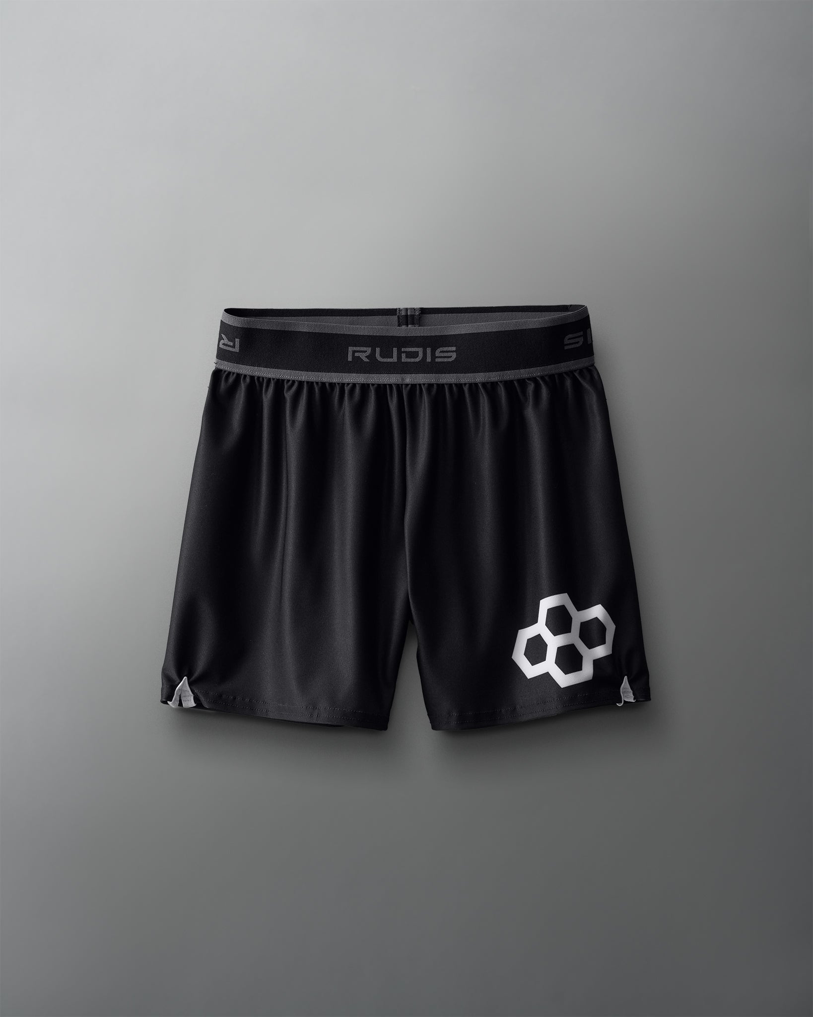 Black athletic shorts with a logo on a gray background