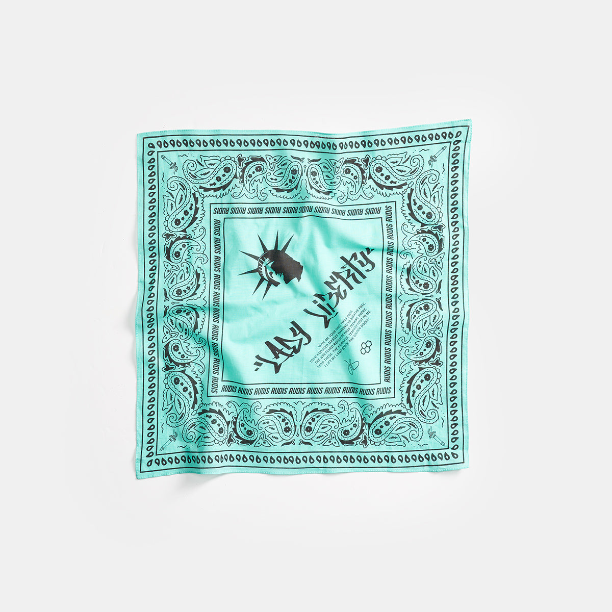 A vibrant turquoise bandana featuring a central graphic of the Statue of Liberty alongside bold text that reads FREE and decorative paisley patterns around the edges