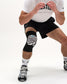 RUDIS Cushion Hypnosis Wrestling Knee Pad worn by a wrestler in an athletic stance