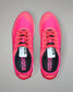 Pair of pink running shoes with visible brand name on a gray background