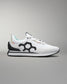 White sneaker with black geometric design on a gray background