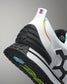 Close-up of a sports shoe with a focus on the sole and brand logo.