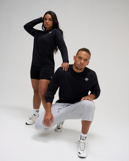 RUDIS Essential Hex Elite Super Soft Long Sleeve T-Shirt in black worn by male and female athletes with RUDIS Hex chest logo.