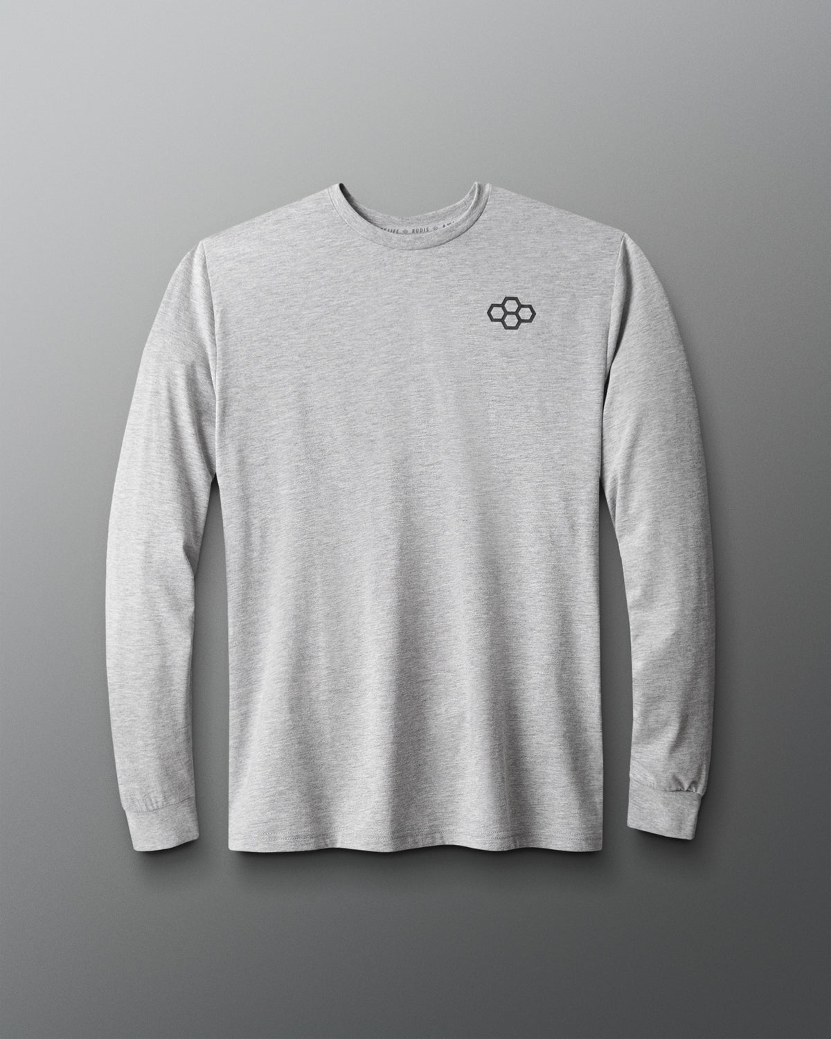Front view of the RUDIS Essential Hex Elite Super Soft Long Sleeve T-Shirt in heather gray, featuring a dark gray RUDIS hex logo on the left chest, classic crew neckline, and ribbed cuffs.