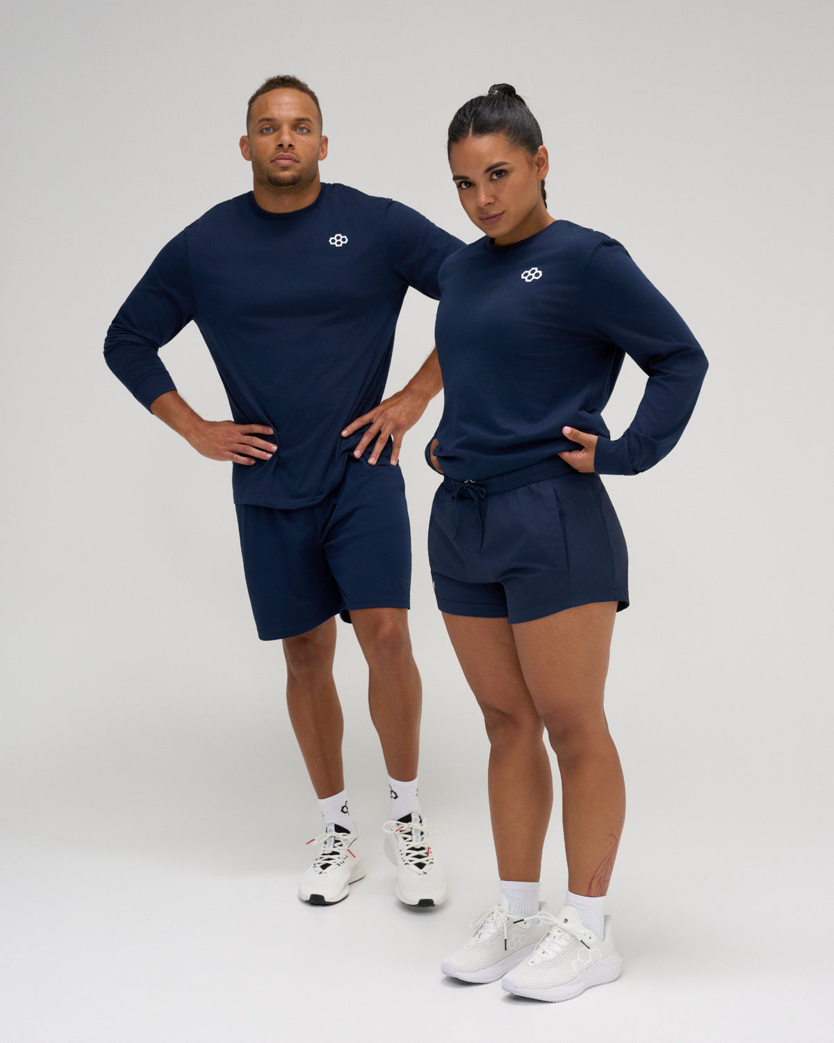 RUDIS Essential Hex Elite Super Soft Long Sleeve T-Shirt in navy worn by male and female athletes with white Hex chest logo.