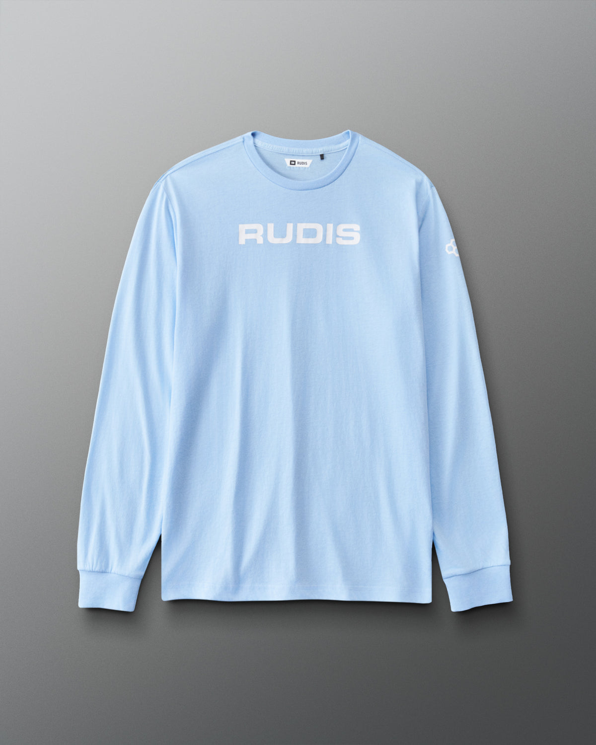 Front view of the light blue RUDIS Elite Super Soft Long Sleeve featuring a white RUDIS wordmark across the chest and RUDIS sleeve logo.