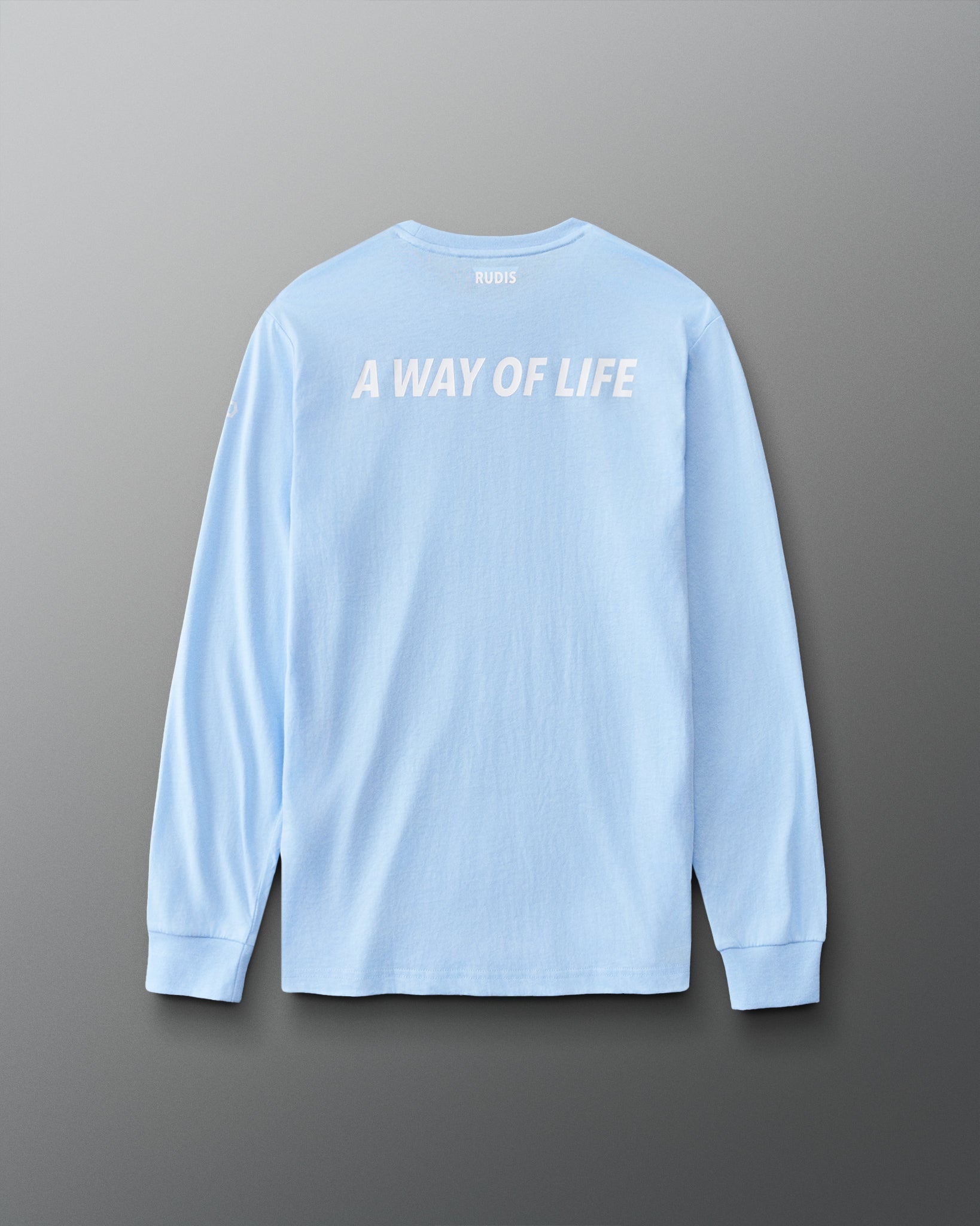 Back view of the light blue RUDIS Elite Super Soft Long Sleeve featuring white “A WAY OF LIFE” lettering and RUDIS branding below the collar.