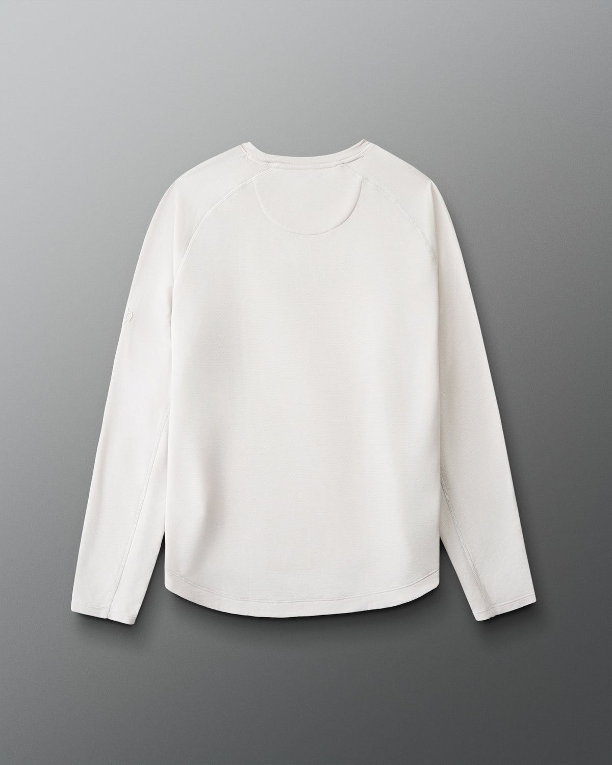 White long-sleeve shirt on a gray background