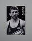 Black and white poster of a wrestler with 'RUDIS' branding on a gray background