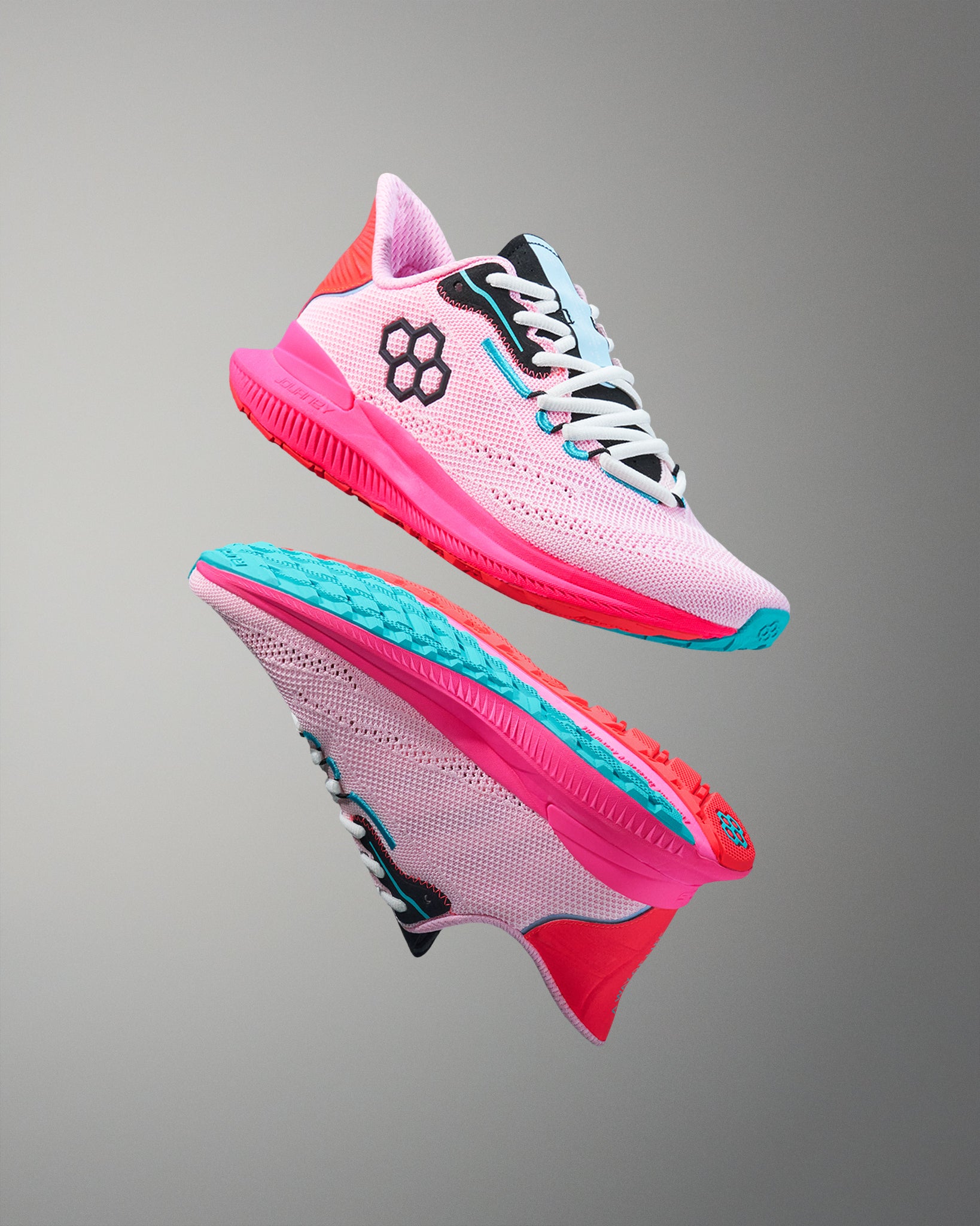 Pink and blue athletic shoes on a gray background