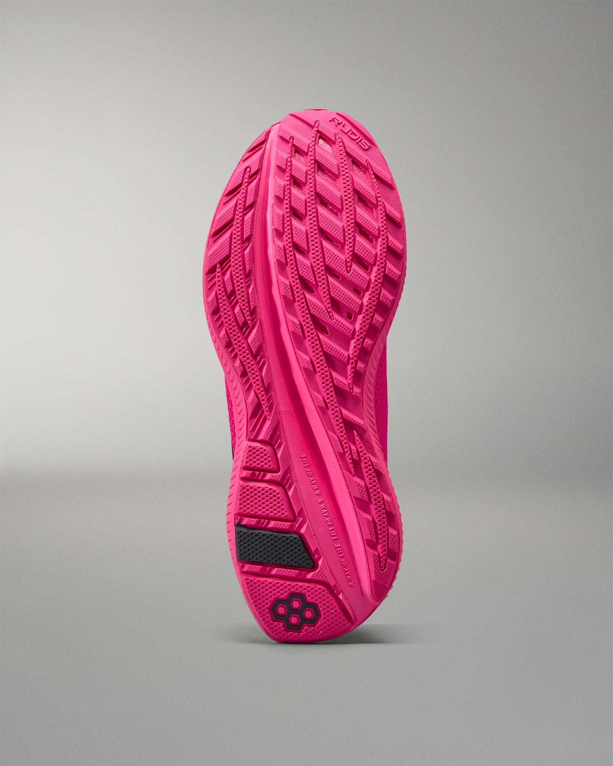 Pink athletic shoe sole on a gray background