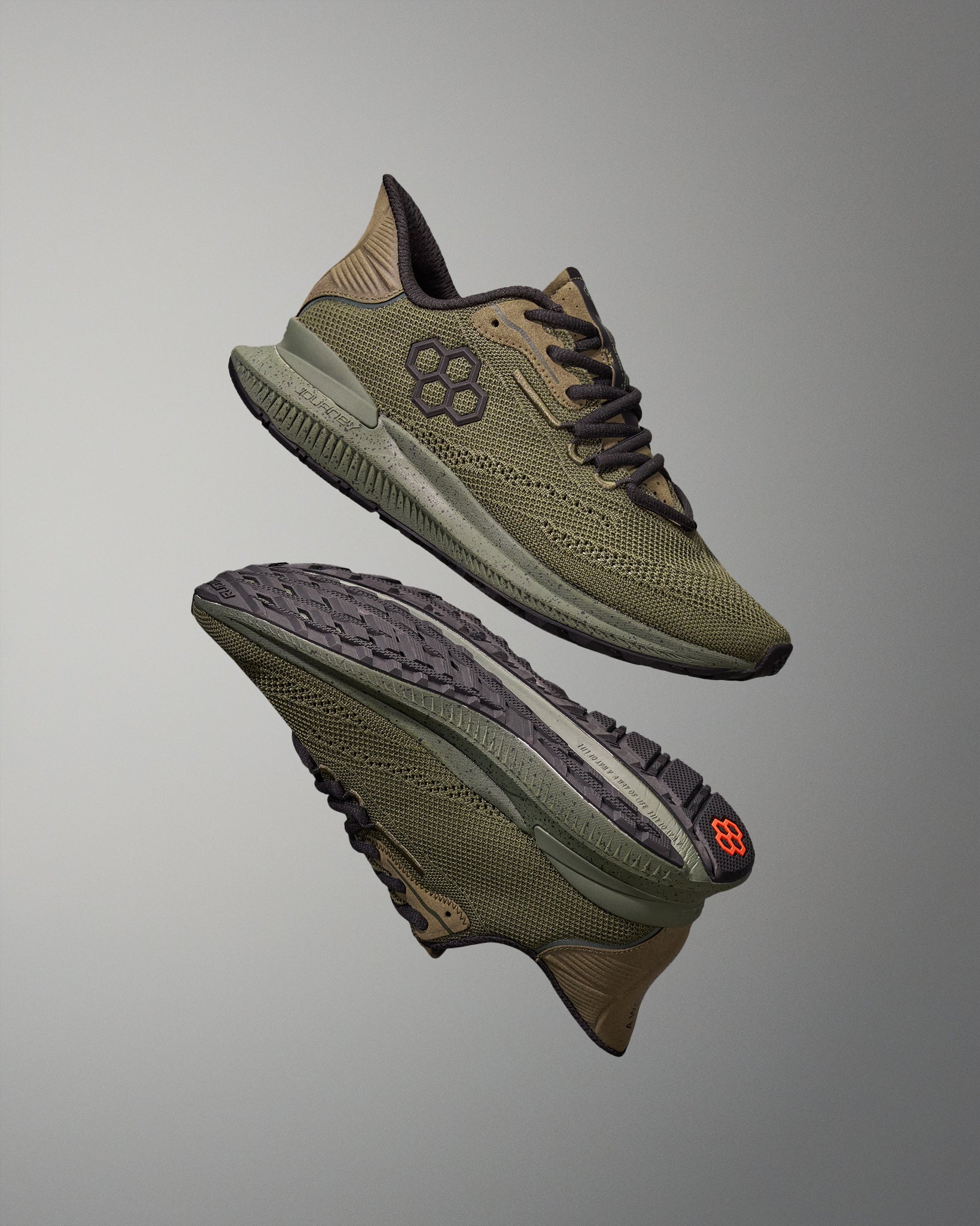 Pair of green training shoes on a gray background