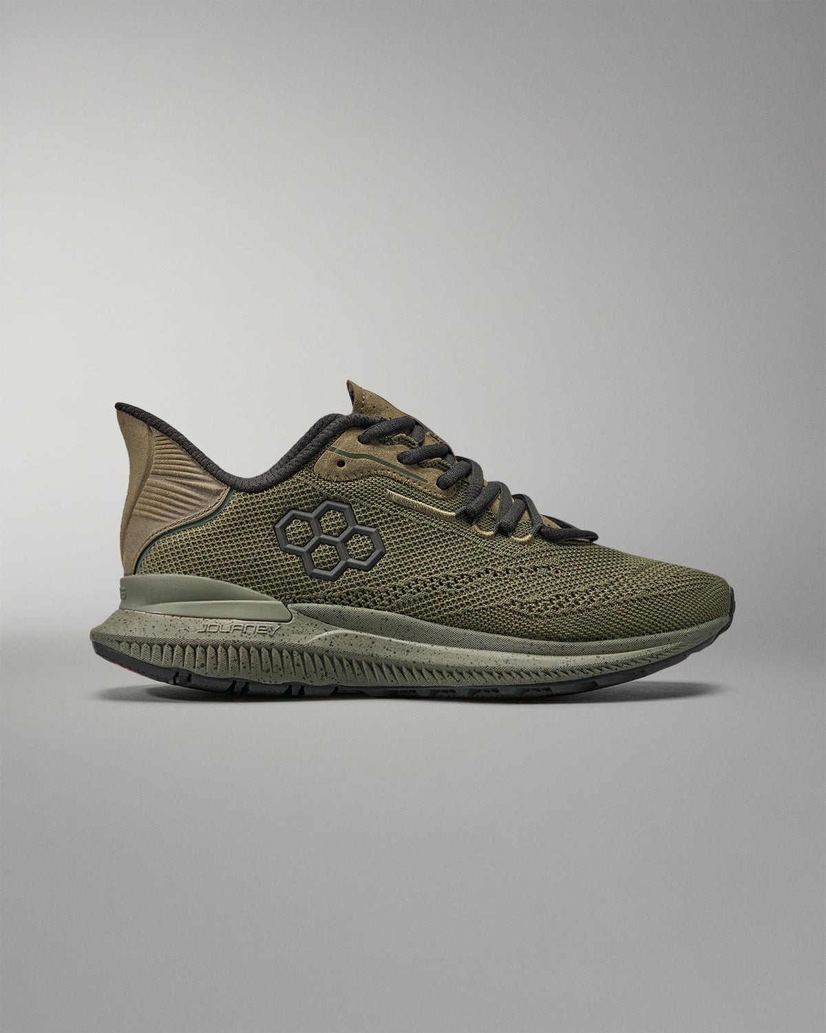 Green training shoe on a gray background