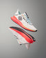 White running shoes with colorful accents on a gray background