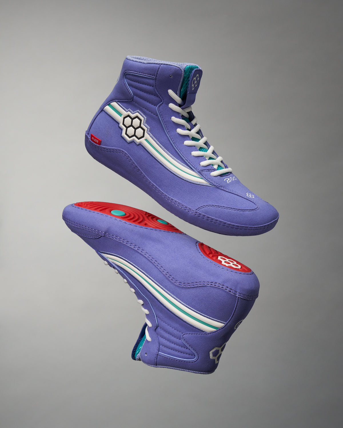 This image features a pair of stylish purple high-top sneakers showcasing a unique design with a geometric motif on the side and a vibrant sole