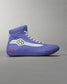 A stylish high-top sneaker in a vibrant purple color featuring unique design elements including a hexagonal logo and streamlined accents