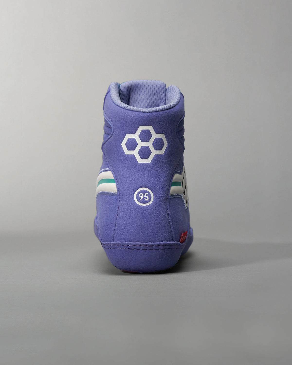 Vibrant purple high-top sneakers featuring a textured finish and unique design elements ideal for both style and comfort