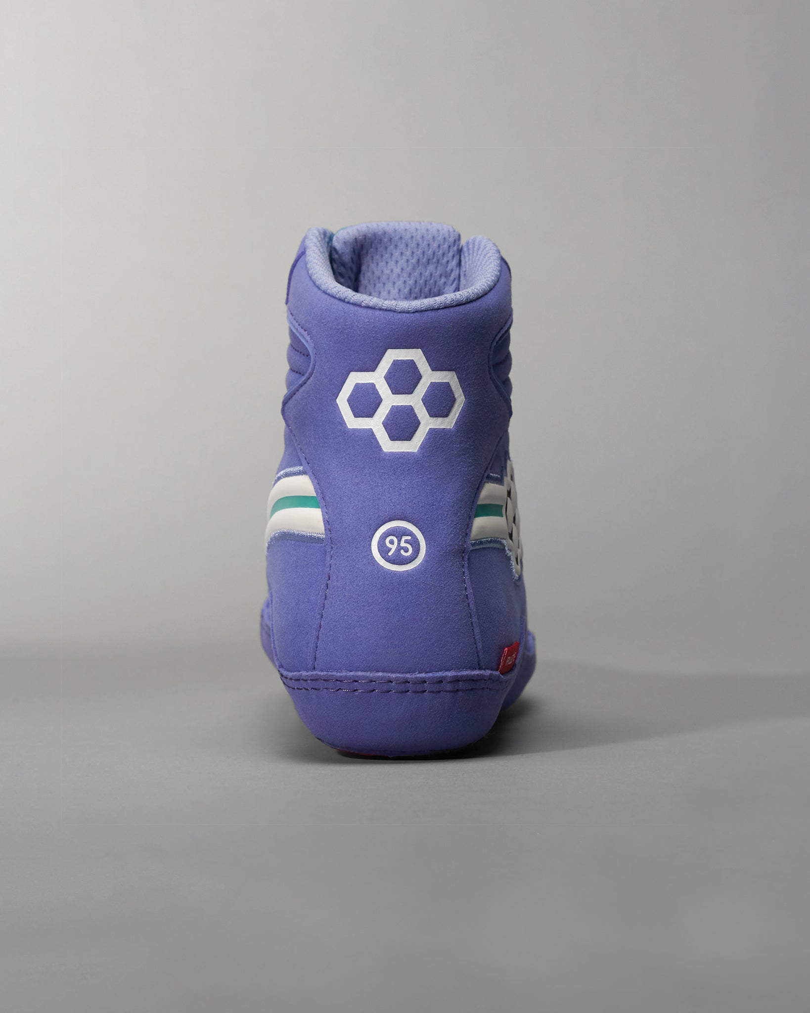Vibrant purple high-top sneakers featuring a textured finish and unique design elements ideal for both style and comfort