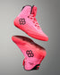 Pink wrestling shoes with black hexagonal logo on a gray background