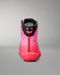 Pink and black wrestling shoe with a smiley face design on a gray background