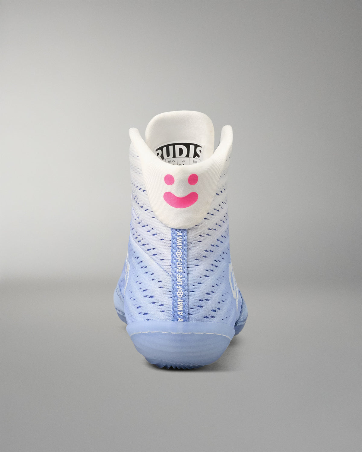 wrestling shoe with a smiley face design on a gray background