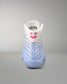 wrestling shoe with a smiley face design on a gray background