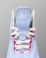 Light blue wrestling shoe with white and pink laces on a gray background