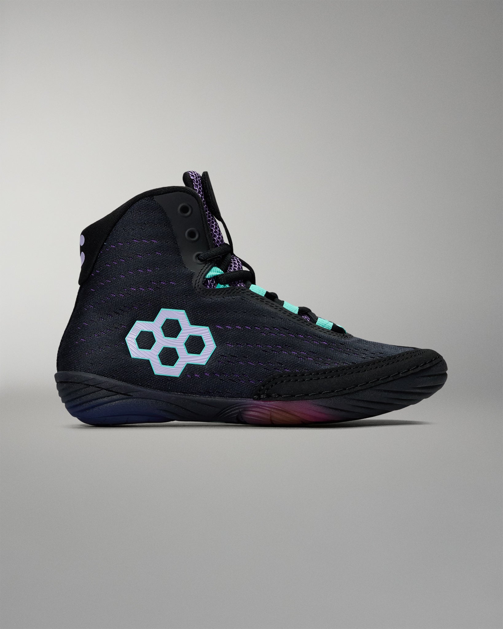 Black high-top sneaker with a unique logo on a gray background