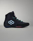 Black high-top sneaker with a unique logo on a gray background
