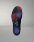 Close-up of a shoe sole with a brand logo on a gray background