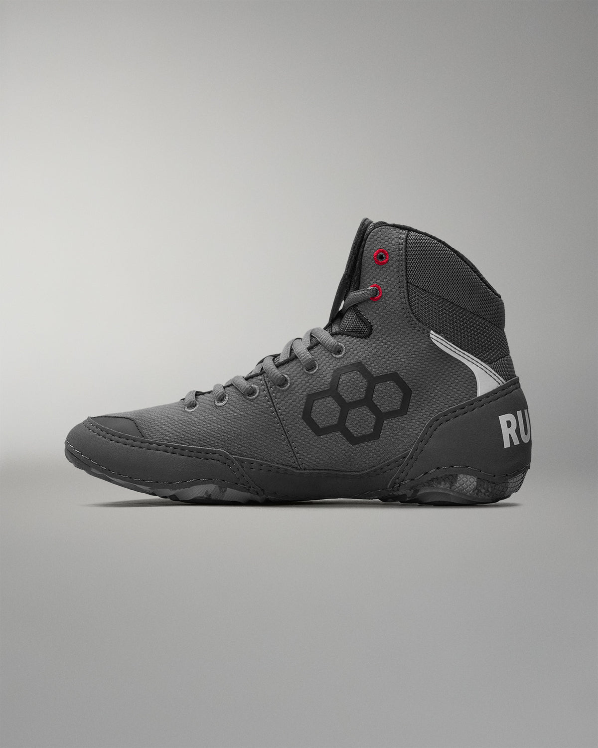 Gray wrestling shoe with a 'RUDIS' brand logo on a gray background