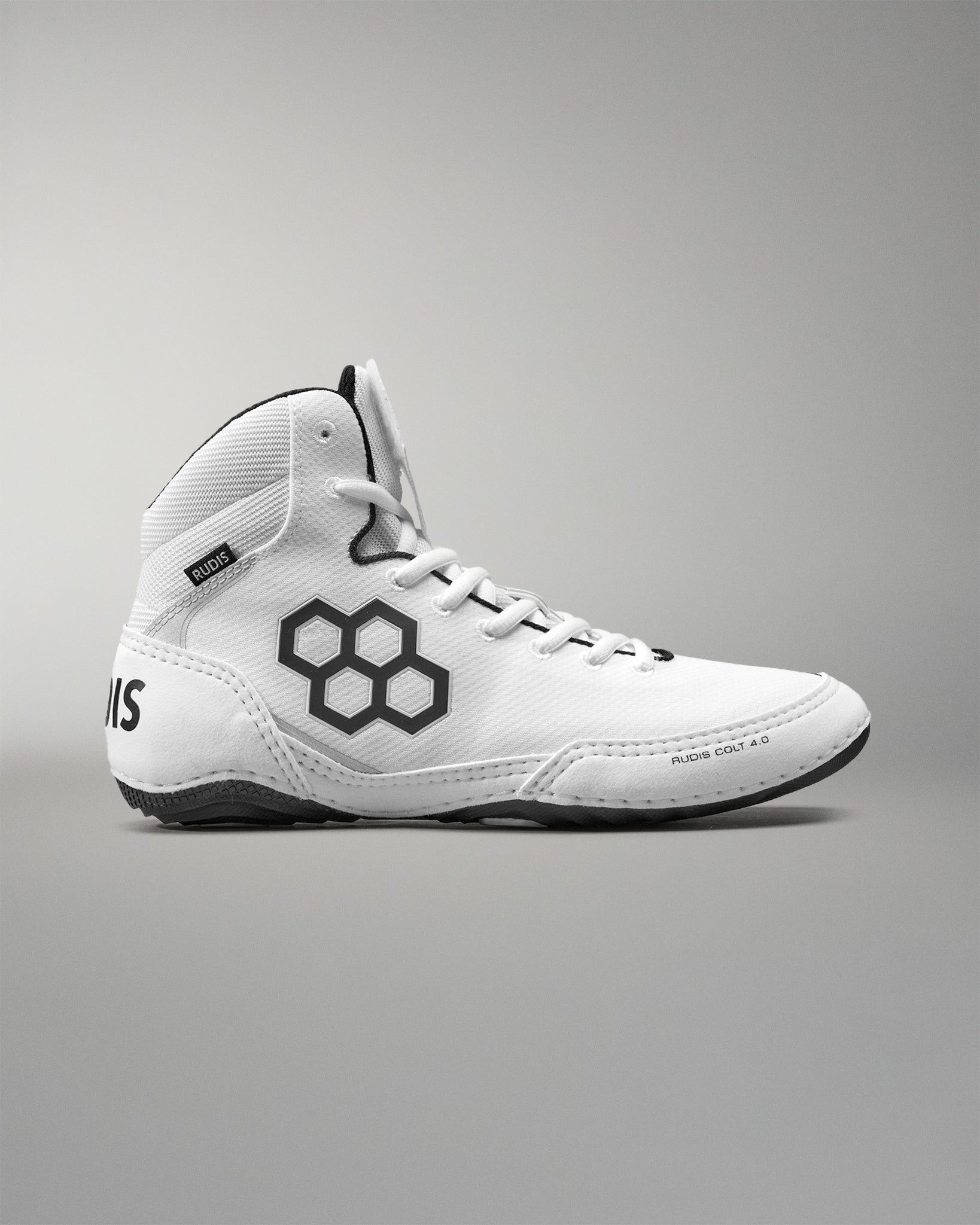 White Wrestling shoe with a black hexagonal logo on a gray background