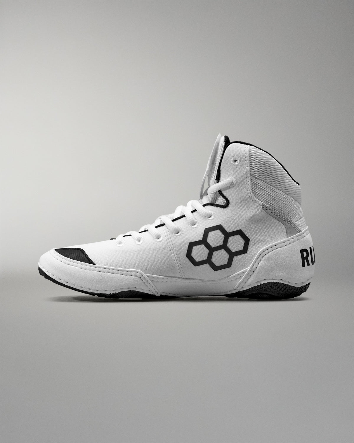 White Wrestling shoe with black accents on a gray background