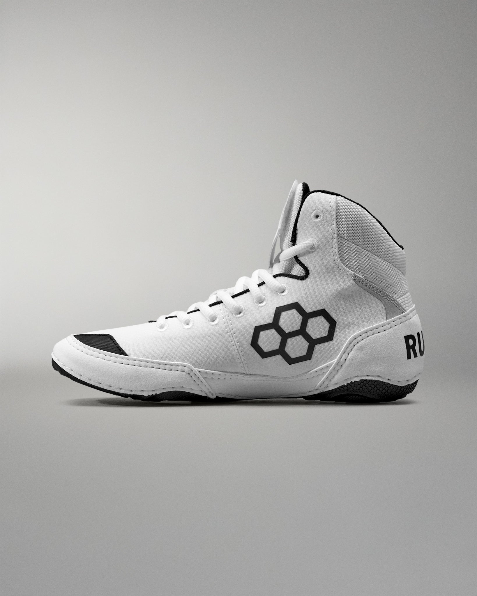 White Wrestling shoe with black accents on a gray background