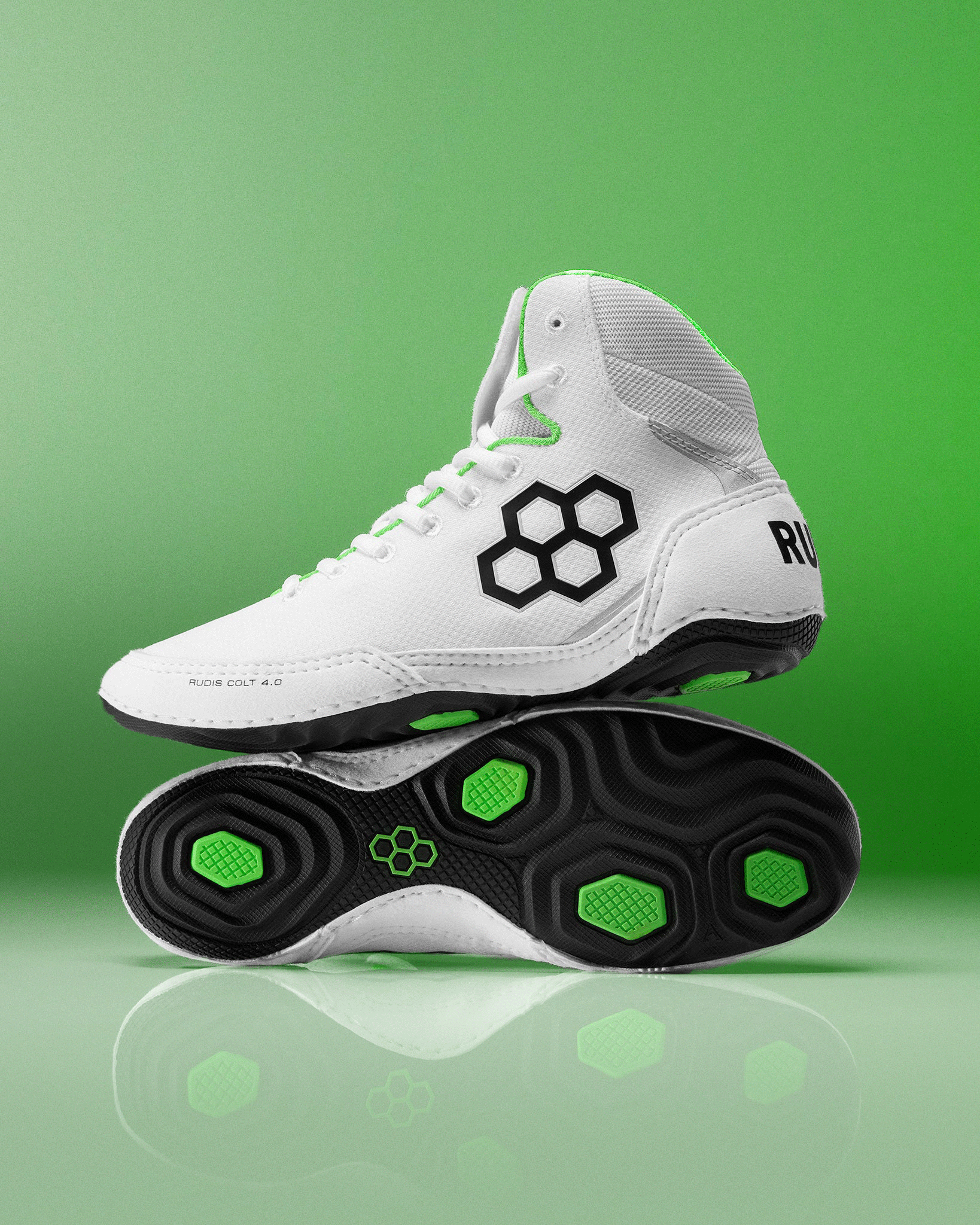 White RUDIS Wrestling Shoes on green background - showing black shoe sole stacked shoes