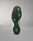 Close-up of a wrestling shoes sole with green hexagonal patterns on a gray background