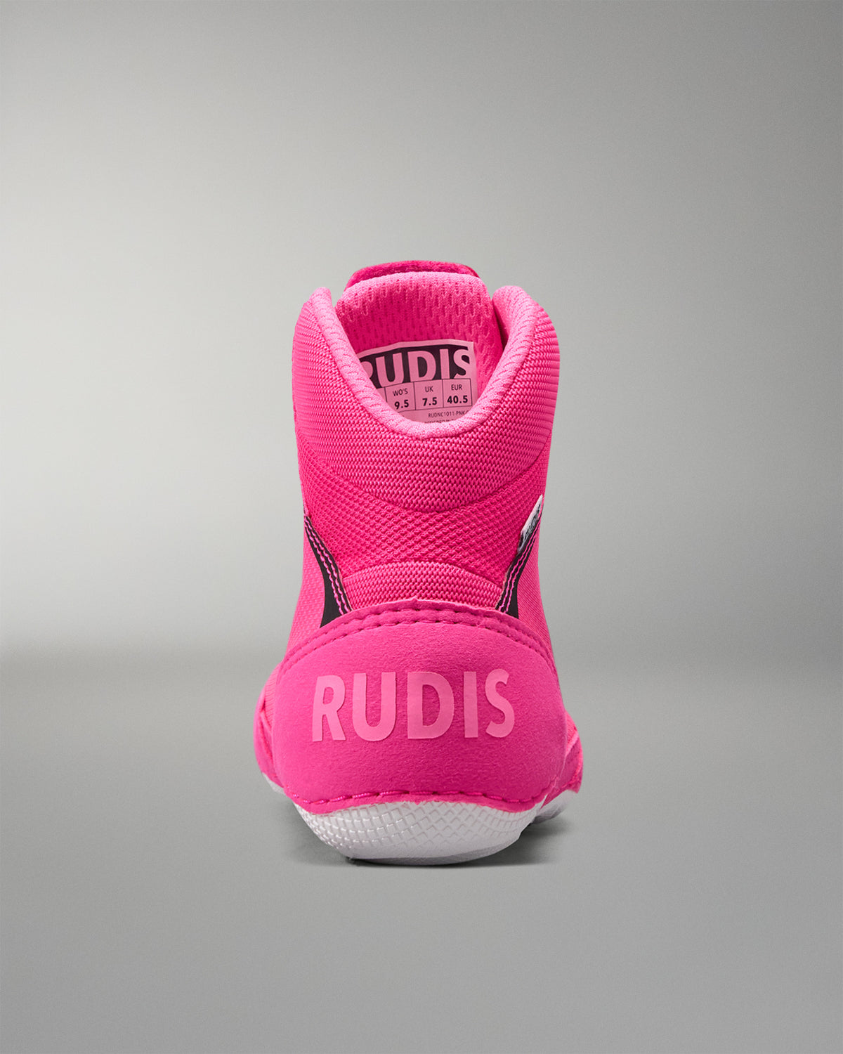 Pink athletic shoe with 'RUDIS' branding on a gray background