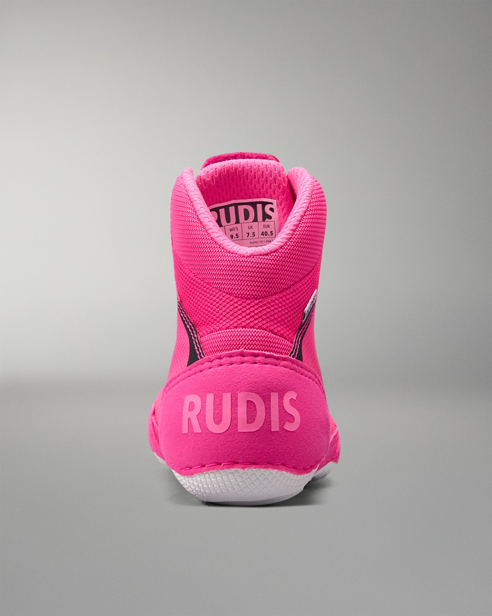 Pink athletic shoe with 'RUDIS' branding on a gray background