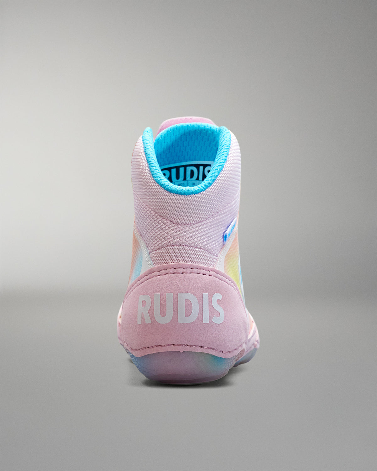 Pink Wrestling shoe with blue lining on a gray background