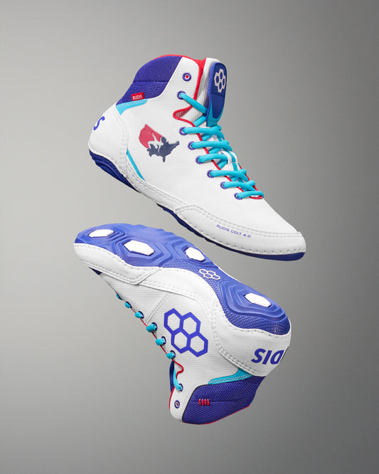 White USA Wrestling Shoes with blue and red accents on a gray background