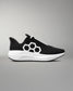 Black and white athletic shoe with a geometric design on a gray background