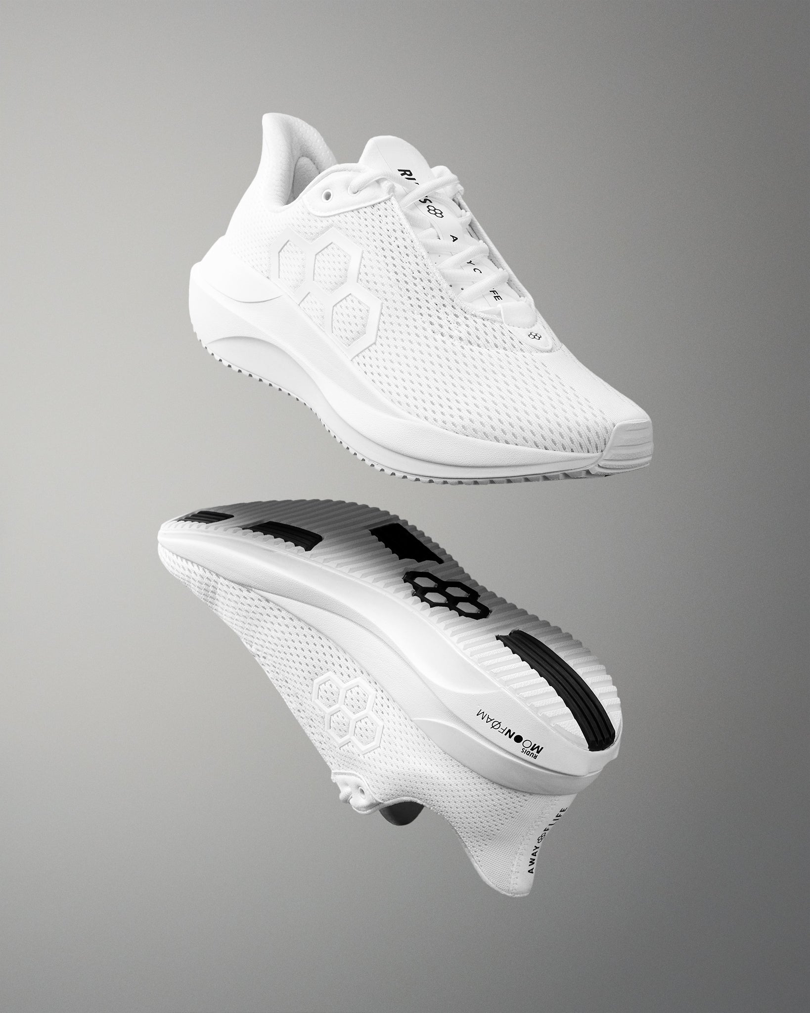 White athletic shoe with brand logo on a gray background