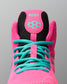 Close-up of a high-top wrestling shoe in bright pink with turquoise laces and a black mesh tongue panel featuring the brand name RUDIS.